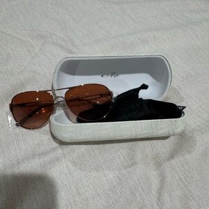 Oakley Silver Frame Sunglasses with Brown Lenses